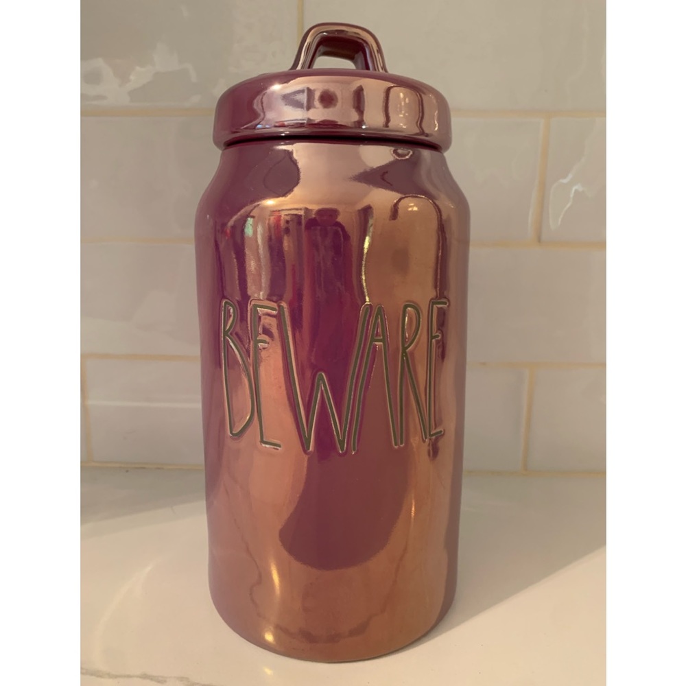Rae Dunn purple iridescent BEWARE canister.